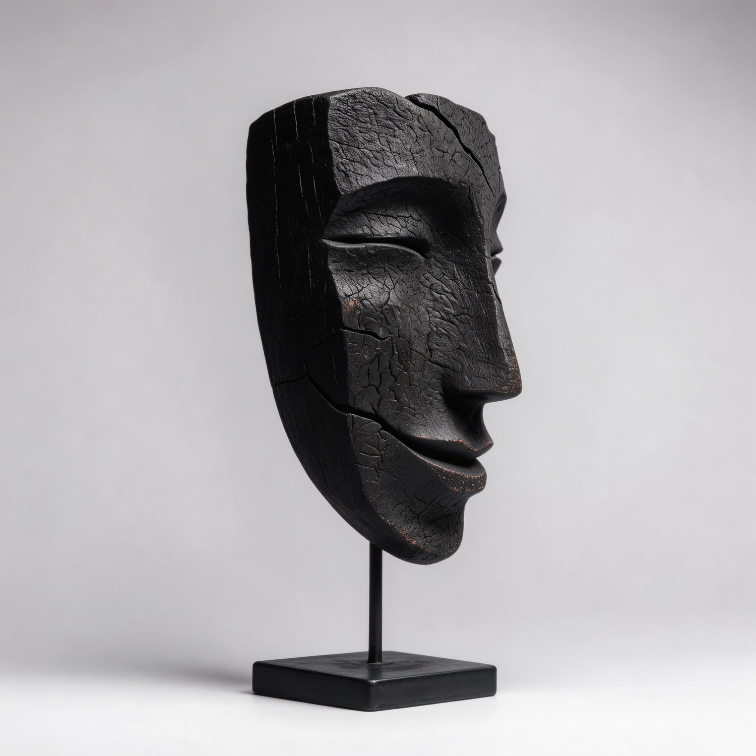 Charcoal Smiling Visage Sculpture