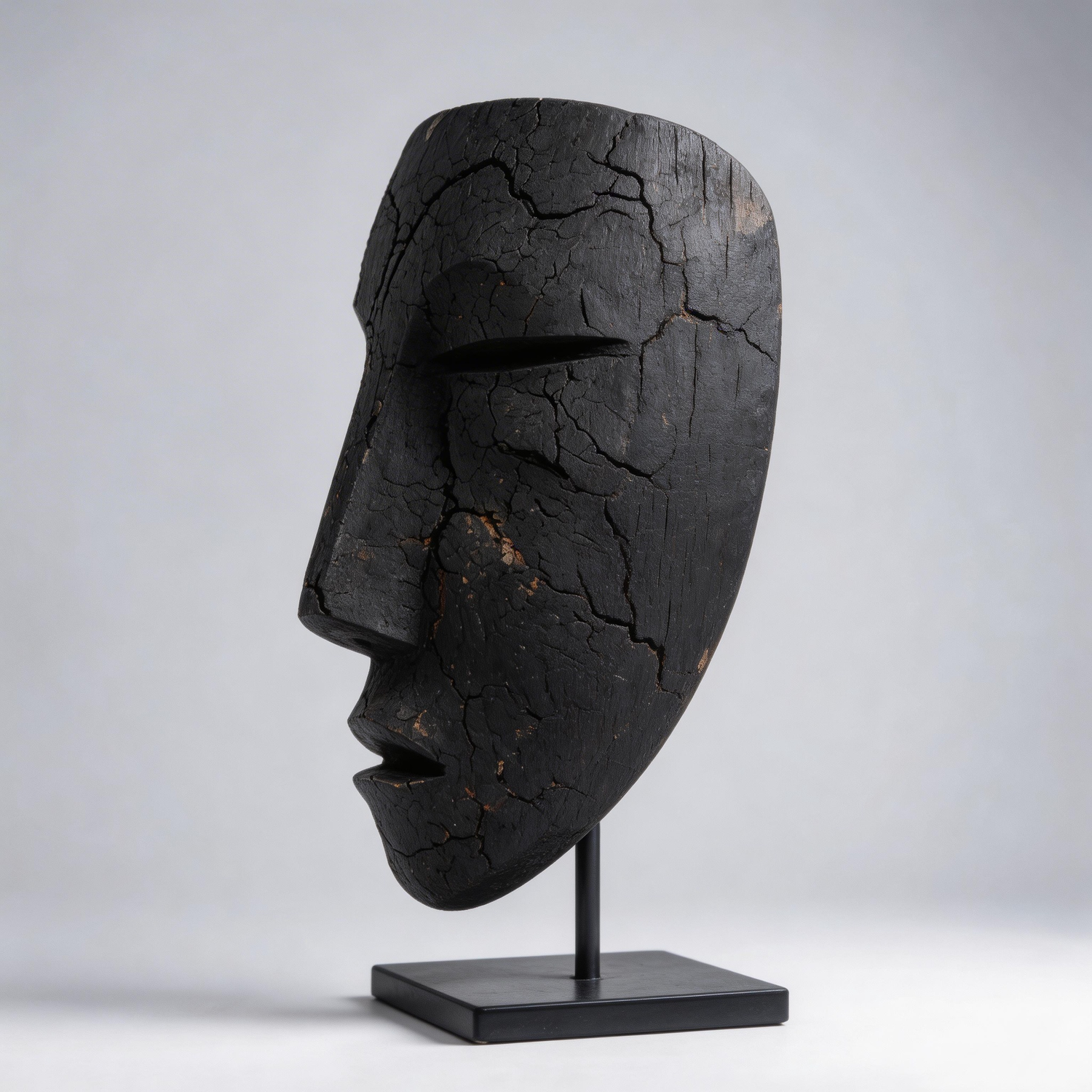 Charcoal Black Eroded Mask Sculpture